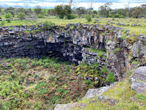 Note the sun shining on rocks under the arch. This sunlight is coming from one of the other sinkholes.